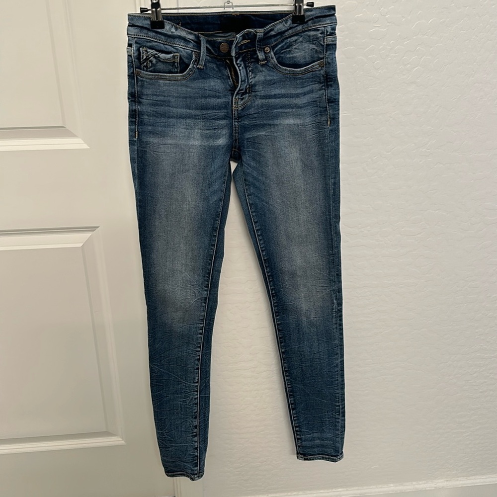 Buckle black skinny jeans